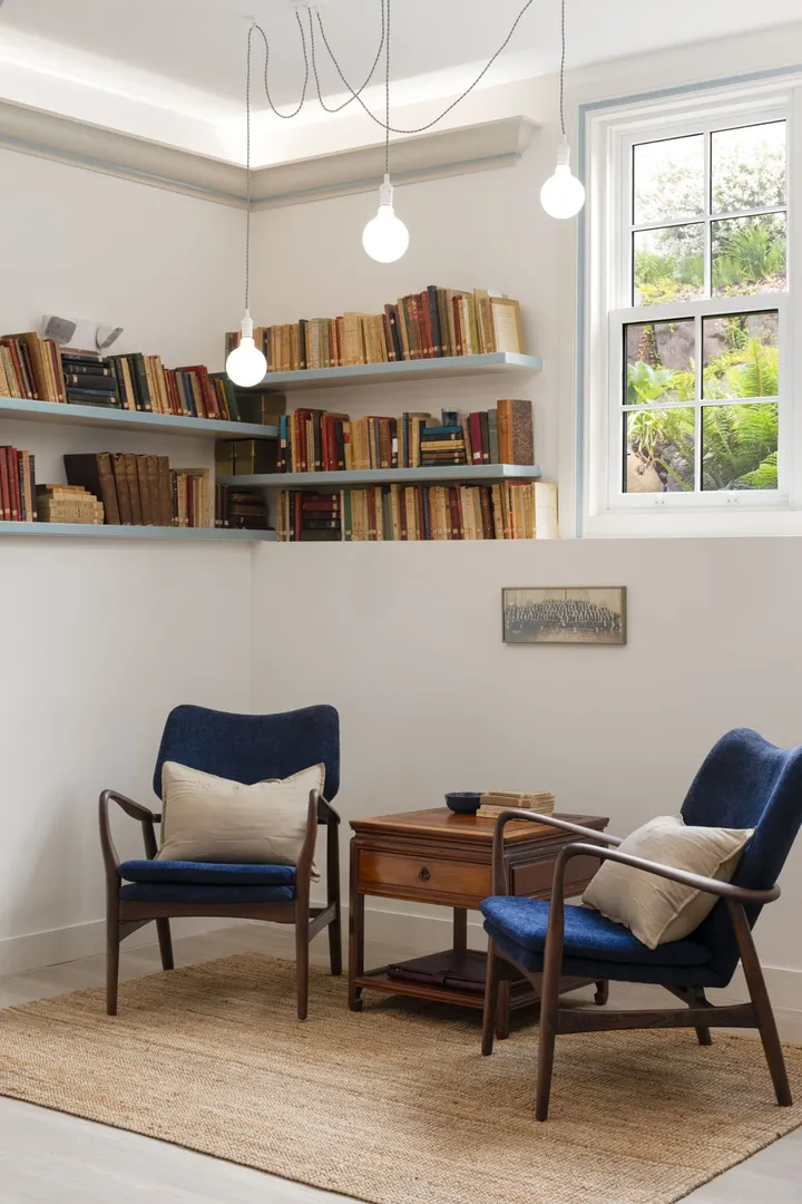 Church Community Space — bookshelf corner with armchairs