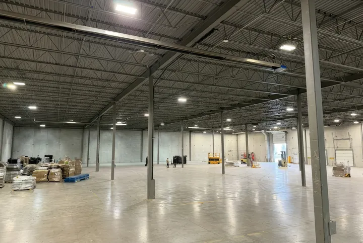 KMS Tools — empty warehouse under construction